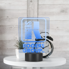 Rogers_Group_Inc_-_Branded_Neon_Sign_Rectangle_Lifestyle_White_Table_Mockup.png